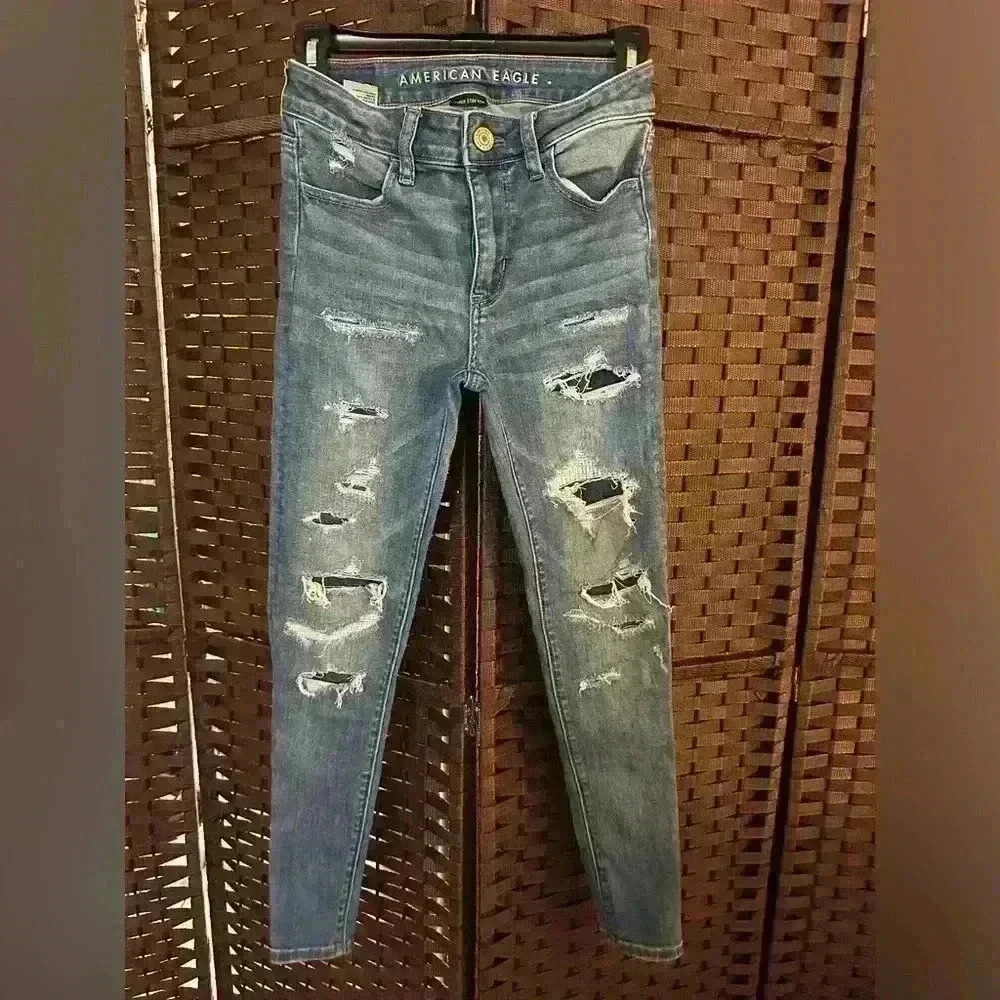 Denim wash skinny jeans with fake rips size 0
